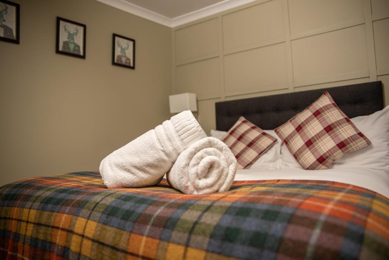 The Oak House Hotel Axbridge Luaran gambar A bed with a duvet